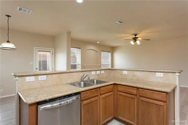 a kitchen with a sink and cabinets