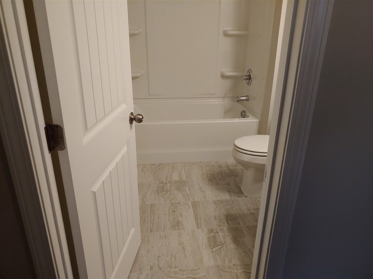1202 Wingstem Place, Unit 1 Raleigh, NC 27607 - Photo 14 of 22 Hall Bath with Upgraded Tile Floor