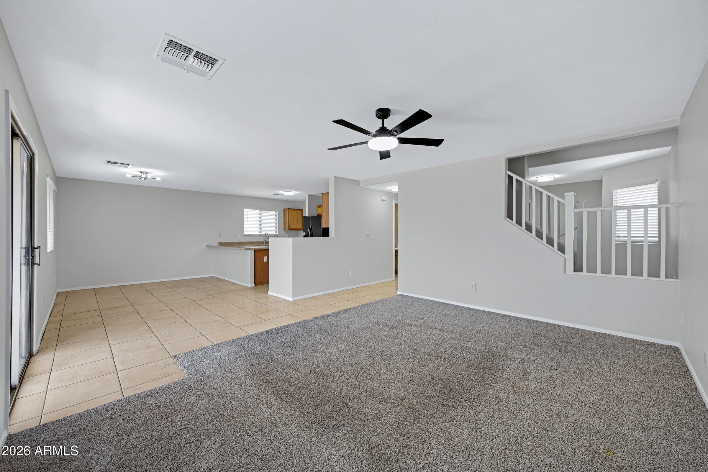 19408 North Braden Road Maricopa, AZ 85138 - Photo 10 of 51 a view of empty room with wooden floor