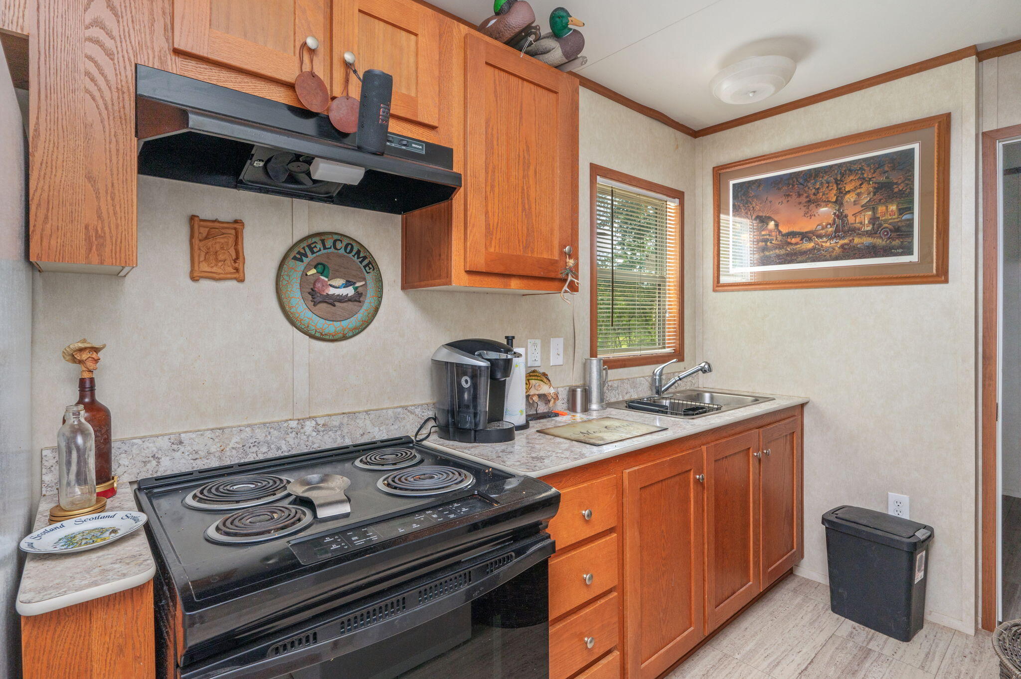 330 Dove Run Road Holt, FL 32564 - Photo 12 of 25 a kitchen with a stove and a microwave