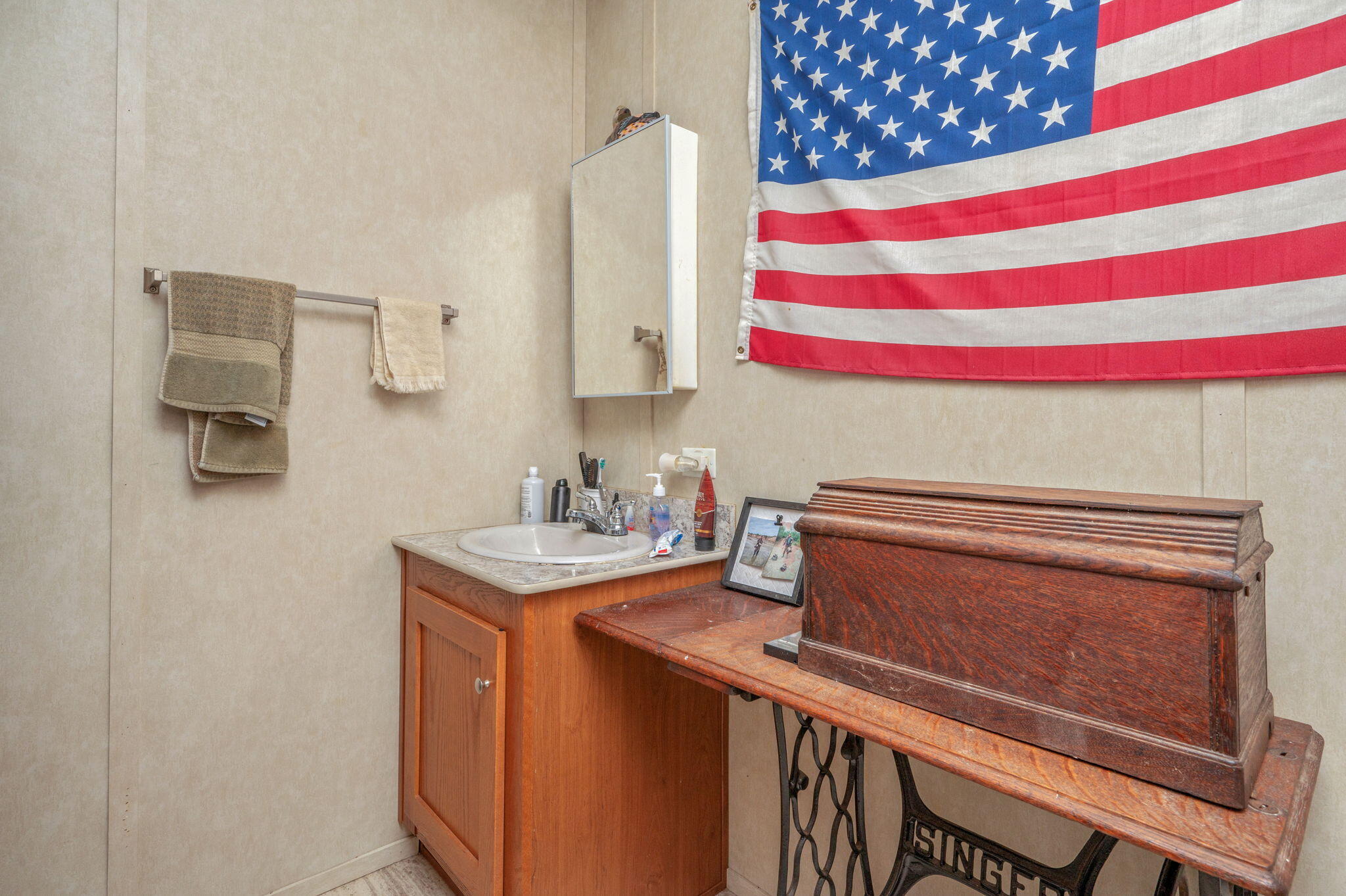330 Dove Run Road Holt, FL 32564 - Photo 14 of 25 a bathroom with a sink a mirror and a toilet