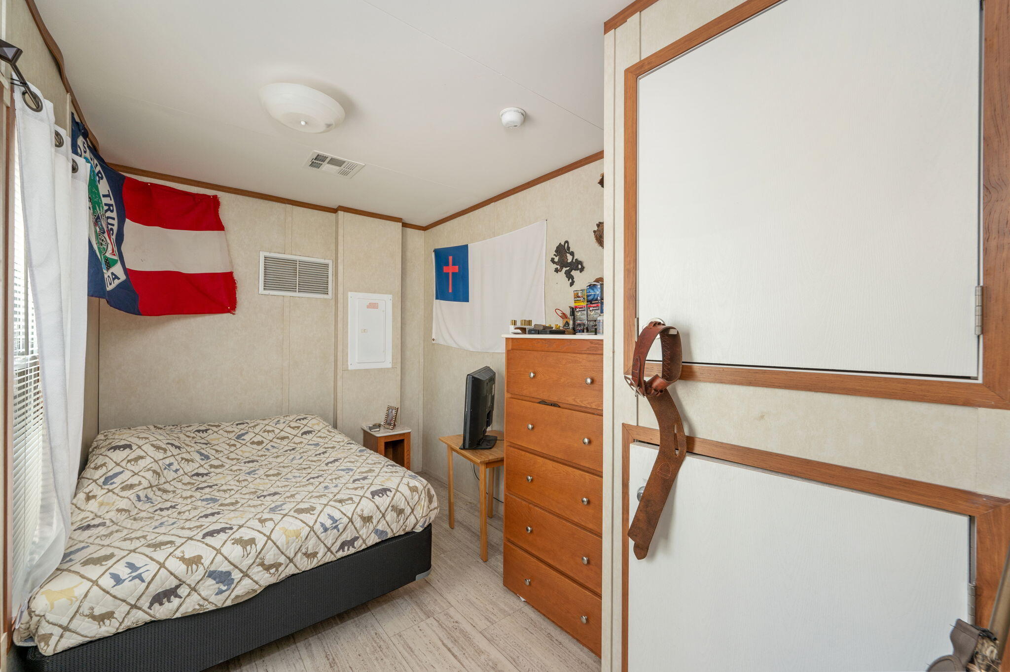 330 Dove Run Road Holt, FL 32564 - Photo 15 of 25 a bedroom with a bed and a cabinets