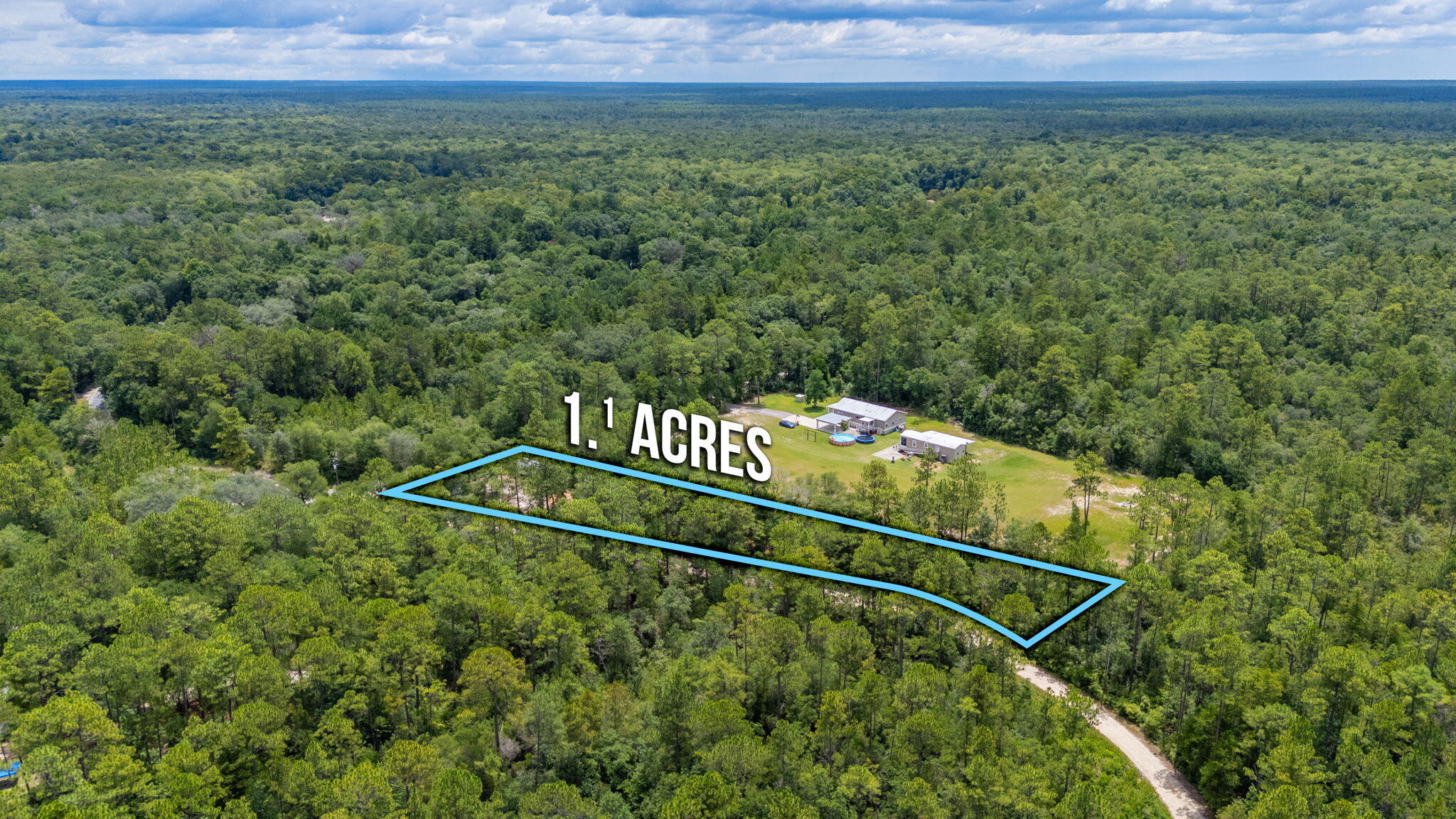 330 Dove Run Road Holt, FL 32564 - Photo 24 of 25 a view of a field with an outdoor space