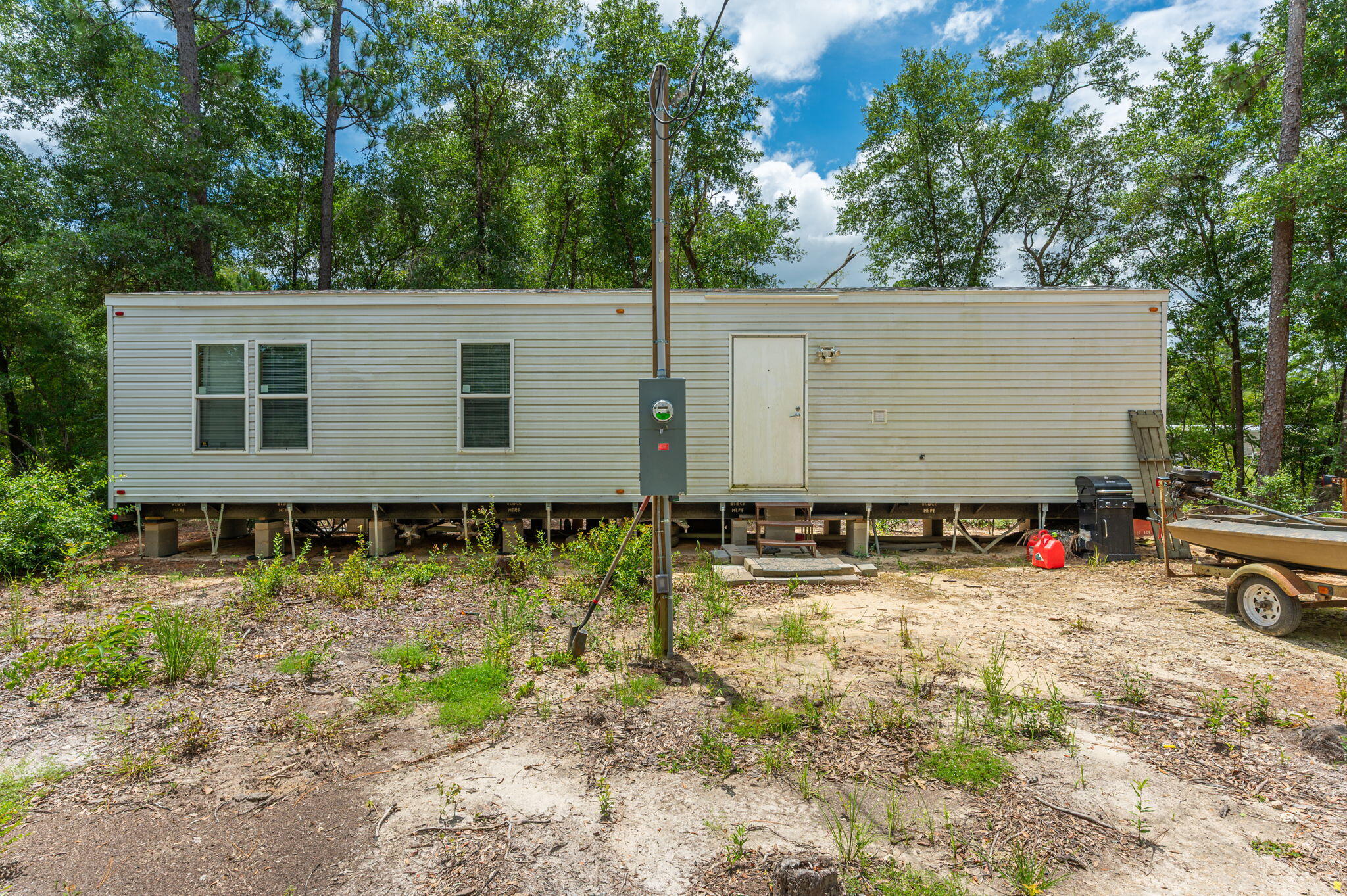 330 Dove Run Road Holt, FL 32564 - Photo 4 of 25 a view of a house with a yard
