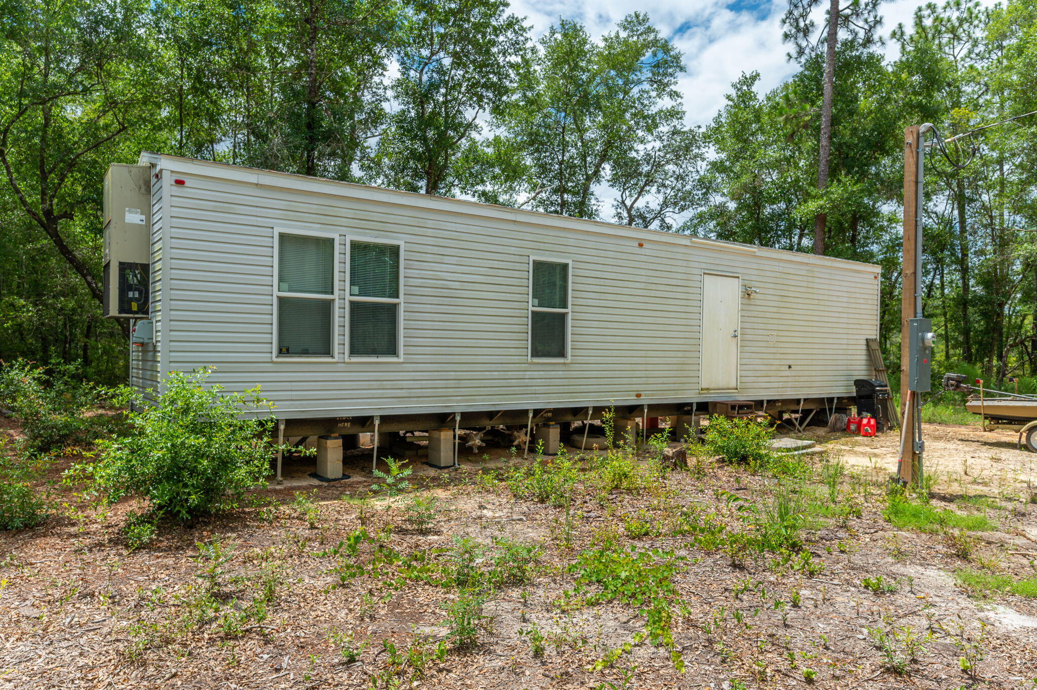330 Dove Run Road Holt, FL 32564 - Photo 5 of 25 a view of a house with backyard