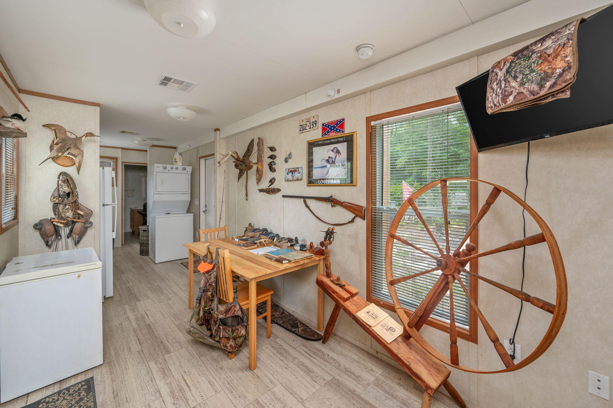 330 Dove Run Road Holt, FL 32564 - Photo 7 of 25 a work room with furniture and a wooden floor