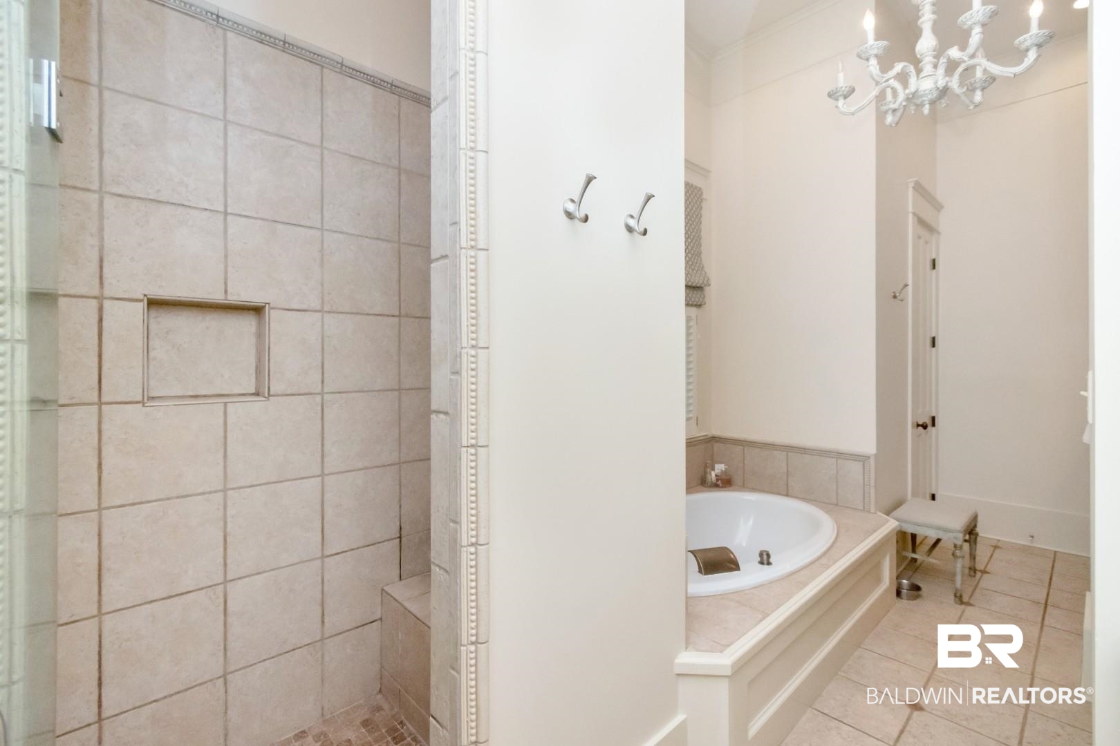 4810 Mums Court Mobile, AL 36608 - Photo 25 of 50 Full bath featuring a garden tub, a walk in shower, tile patterned floors, and a chandelier