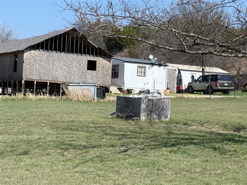 167 Blue Sky Lane Springtown, TX 76082 - Photo 21 of 34 a view of a house with a yard