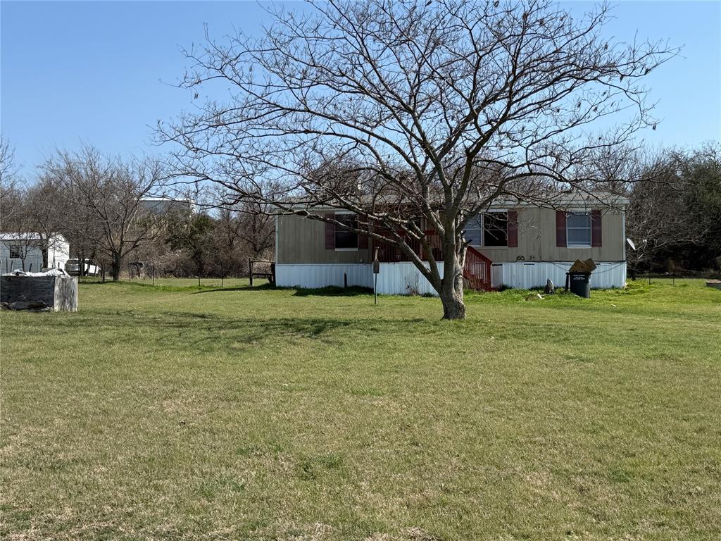 167 Blue Sky Lane Springtown, TX 76082 - Photo 22 of 34 a view of a house with a yard