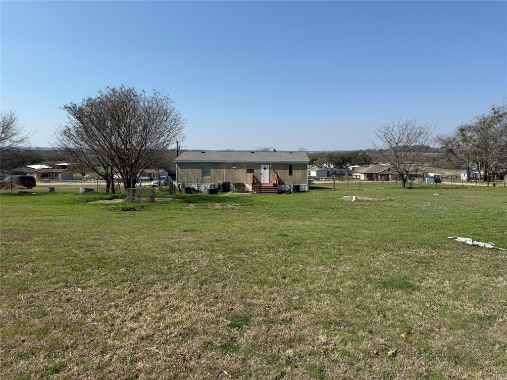167 Blue Sky Lane Springtown, TX 76082 - Photo 26 of 34 a view of a field with lawn chairs and plants