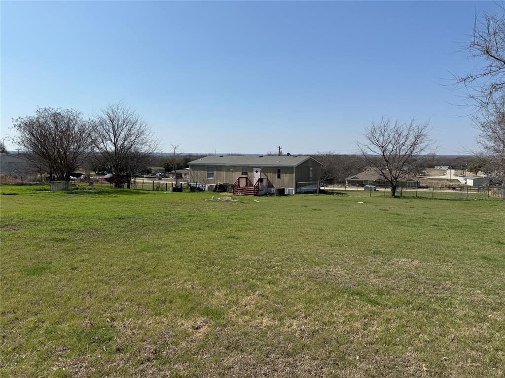 167 Blue Sky Lane Springtown, TX 76082 - Photo 29 of 34 a view of a lake with houses