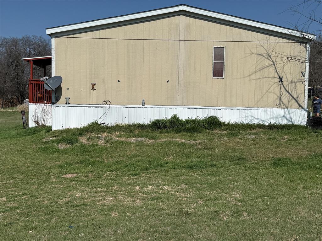 167 Blue Sky Lane Springtown, TX 76082 - Photo 31 of 34 a front view of a house with a yard