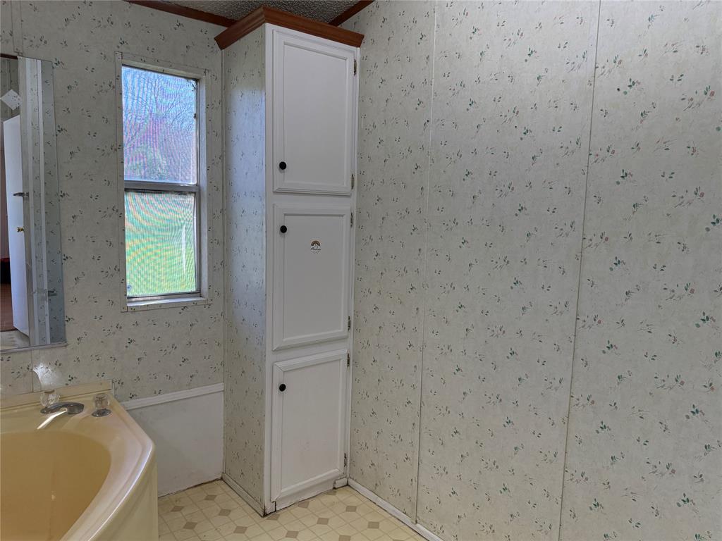167 Blue Sky Lane Springtown, TX 76082 - Photo 9 of 34 a bathroom with a tub and shower