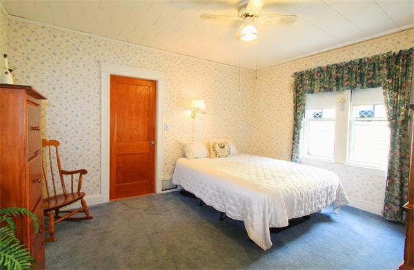158 Parmenter Road Newton, MA 02465 - Photo 11 of 19 a bed sitting in a bedroom next to a window