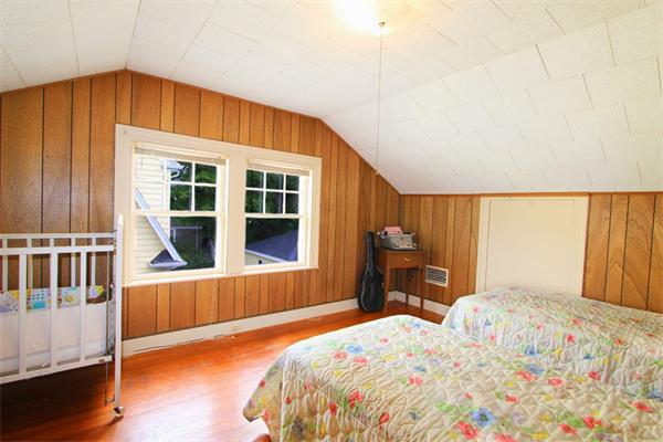158 Parmenter Road Newton, MA 02465 - Photo 12 of 19 a bedroom with a bed and wooden floor