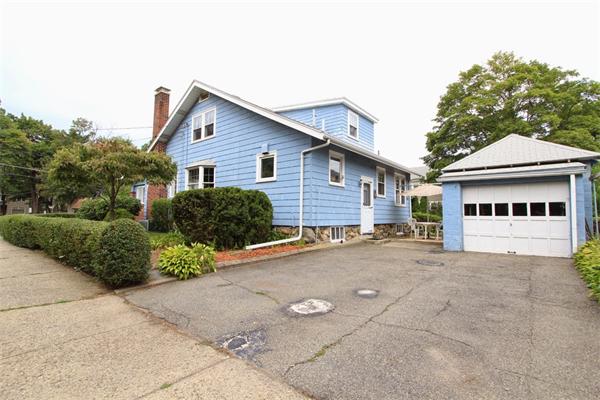 158 Parmenter Road Newton, MA 02465 - Photo 16 of 19 a front view of a house with a yard and garage