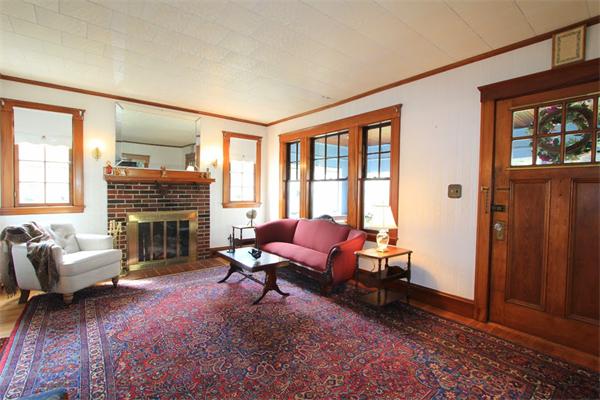 158 Parmenter Road Newton, MA 02465 - Photo 4 of 19 a living room with furniture and a fireplace
