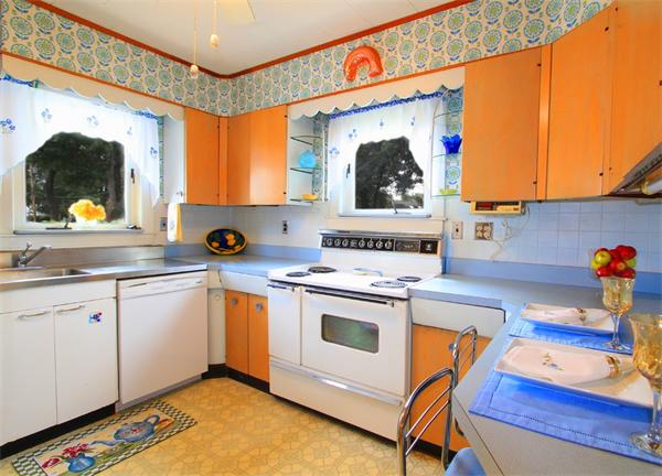 158 Parmenter Road Newton, MA 02465 - Photo 9 of 19 a kitchen with stainless steel appliances granite countertop a stove a sink and a microwave