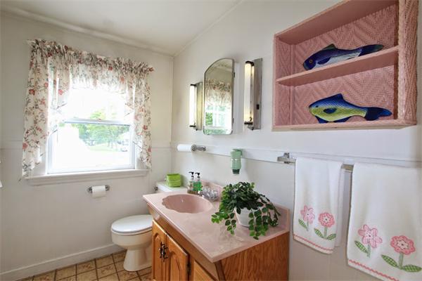 158 Parmenter Road Newton, MA 02465 - Photo 10 of 19 a bathroom with a sink mirror vanity and toilet