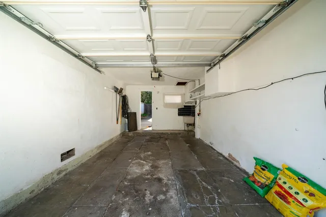 a view of a storage & utility room with a sink