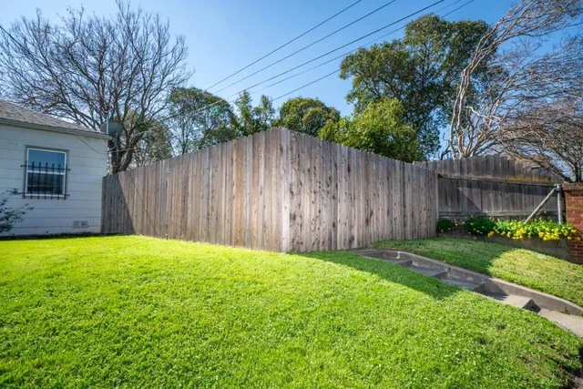 a view of a backyard with a small cabin