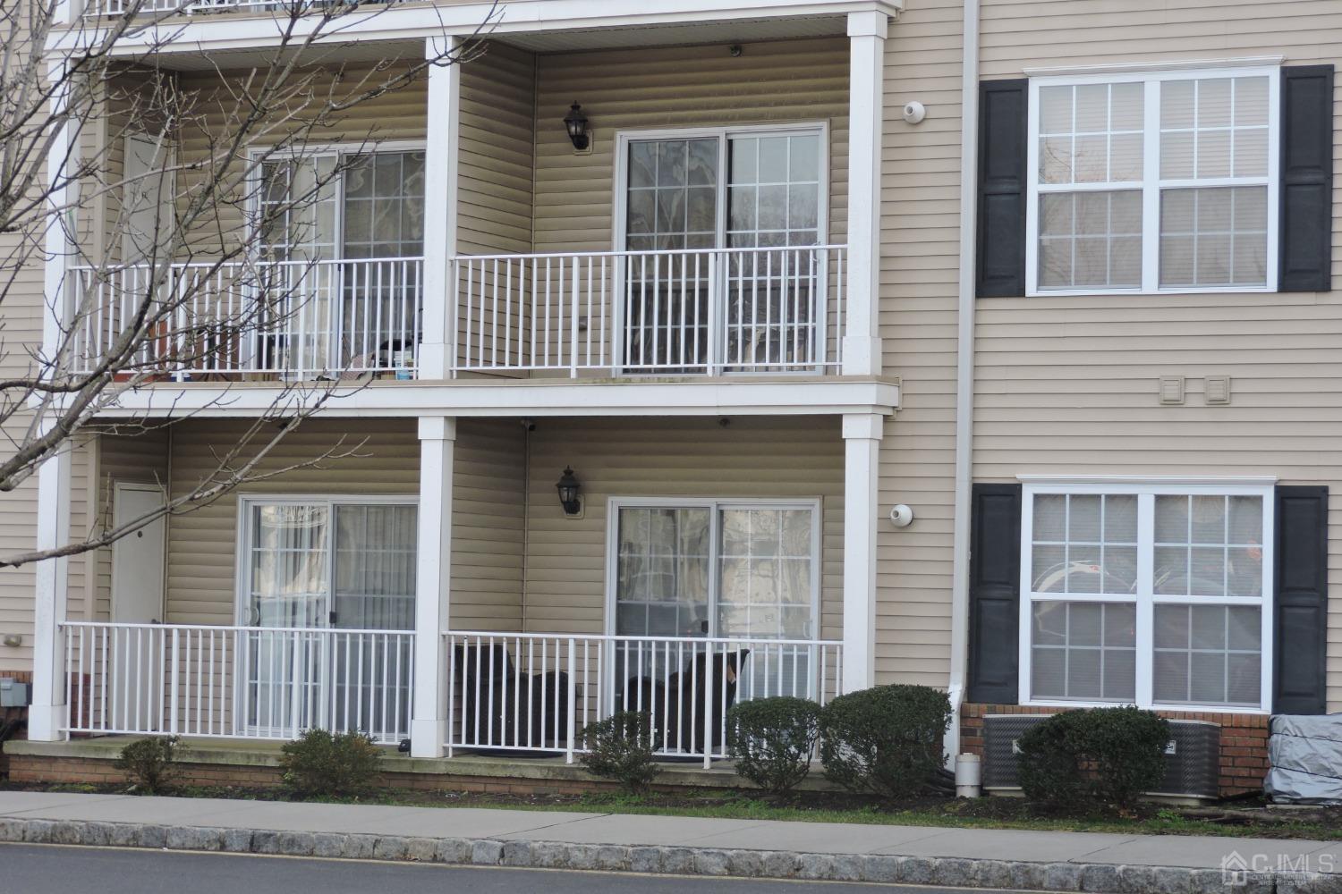 81 Liddle Avenue Edison, NJ 08837 - Photo 3 of 20 a front view of a house with a garden