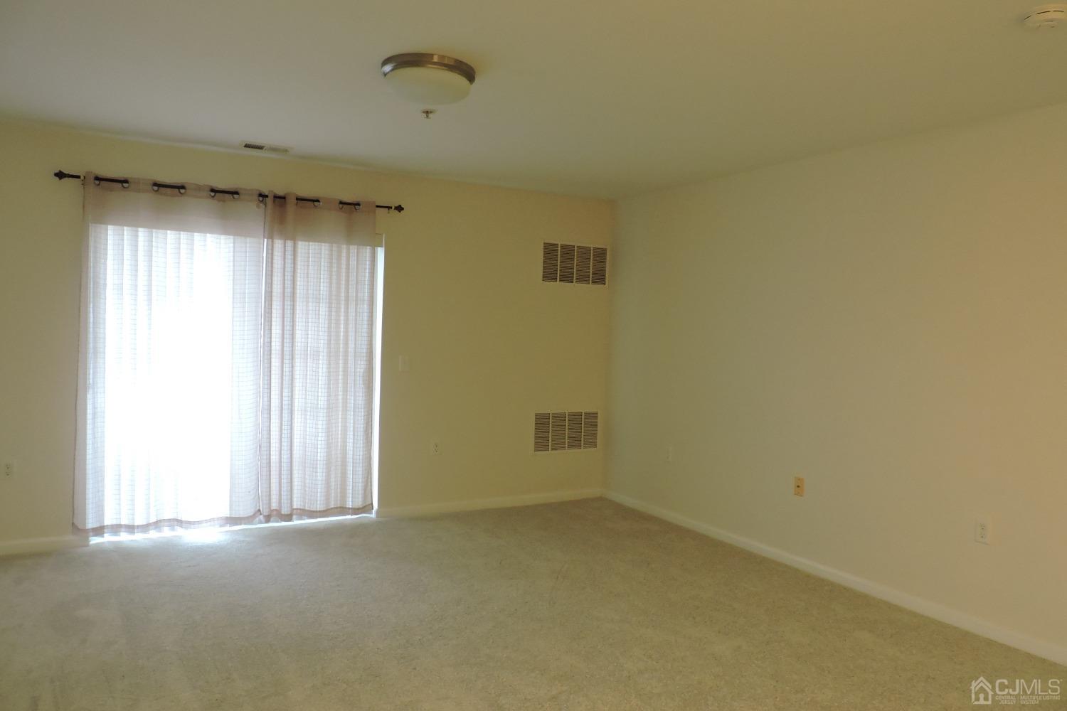 81 Liddle Avenue Edison, NJ 08837 - Photo 7 of 20 an empty room with a empty space and a window