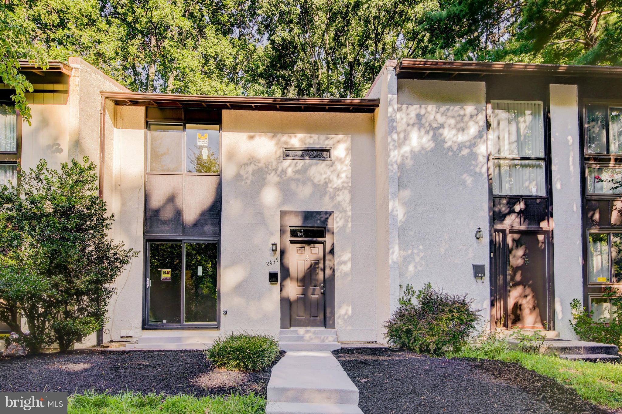 2459 Pyrenees Court Reston, VA 20191 - Photo 1 of 28 a front view of a house with garden