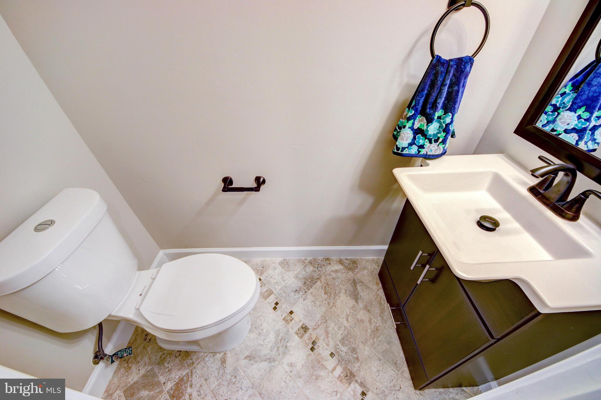 2459 Pyrenees Court Reston, VA 20191 - Photo 13 of 28 a bathroom with a sink toilet and mirror