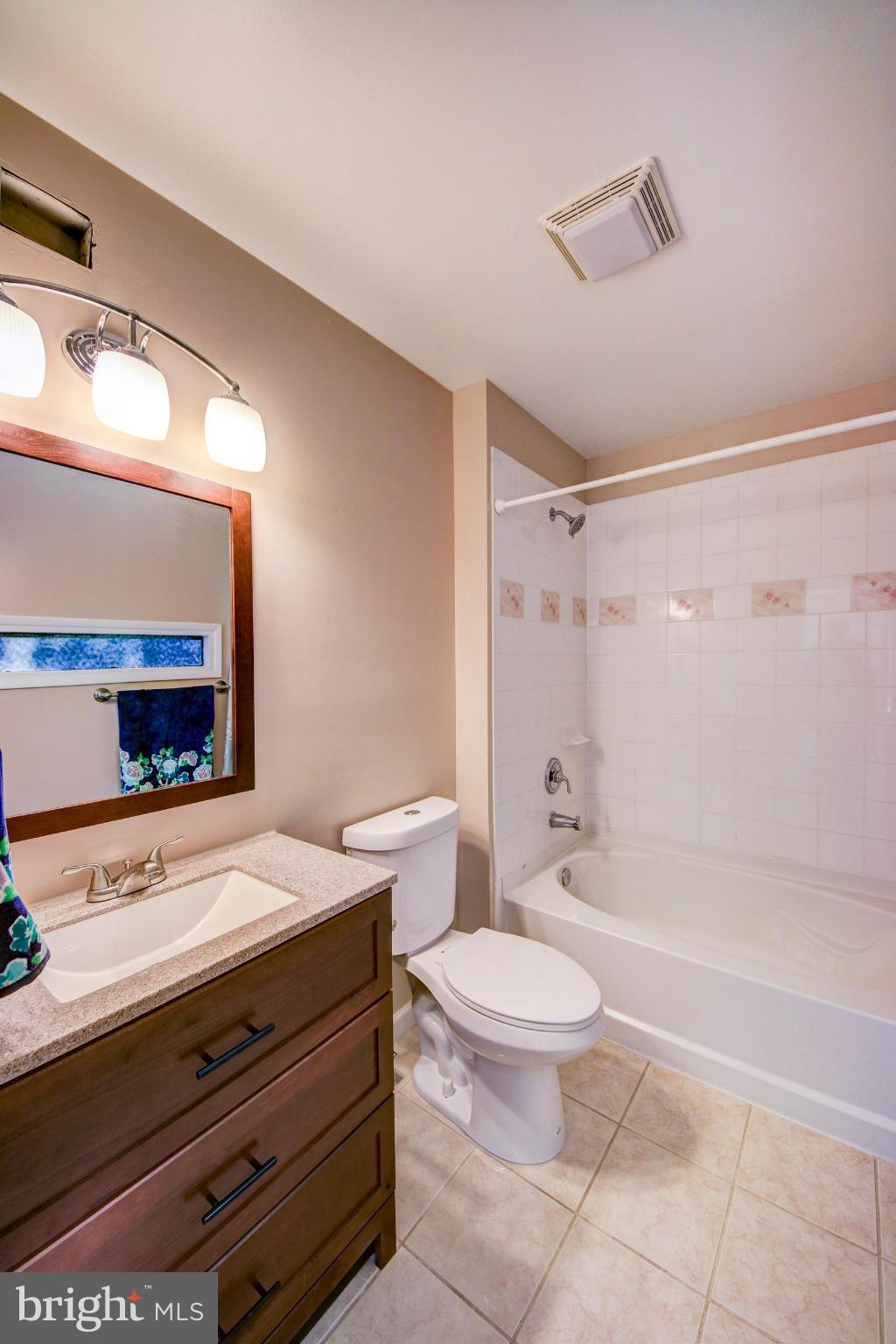2459 Pyrenees Court Reston, VA 20191 - Photo 14 of 28 a bathroom with a sink a toilet and a bathtub