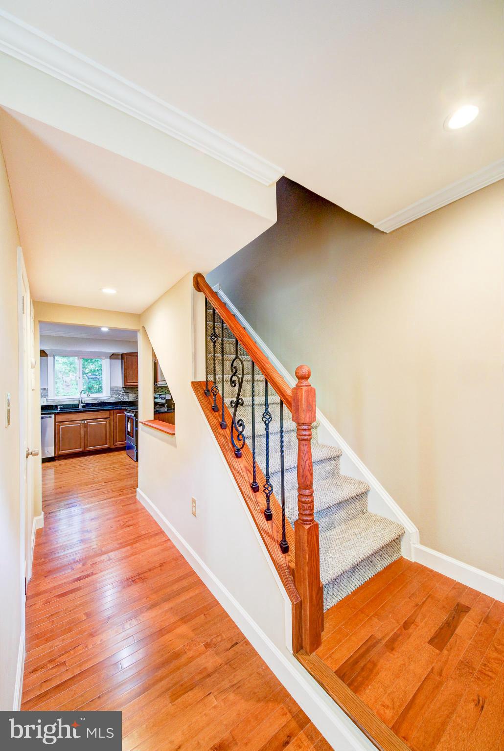 2459 Pyrenees Court Reston, VA 20191 - Photo 3 of 28 a view of staircase with white walls and a next to a window