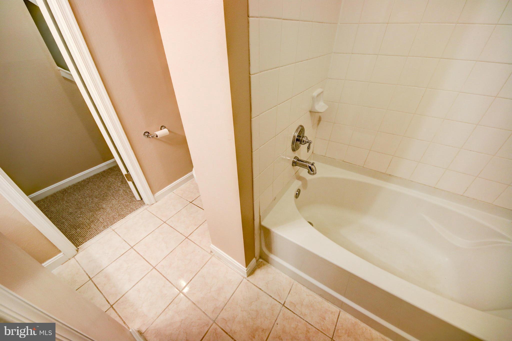 2459 Pyrenees Court Reston, VA 20191 - Photo 23 of 28 a spacious bathroom with a bathtub and shower