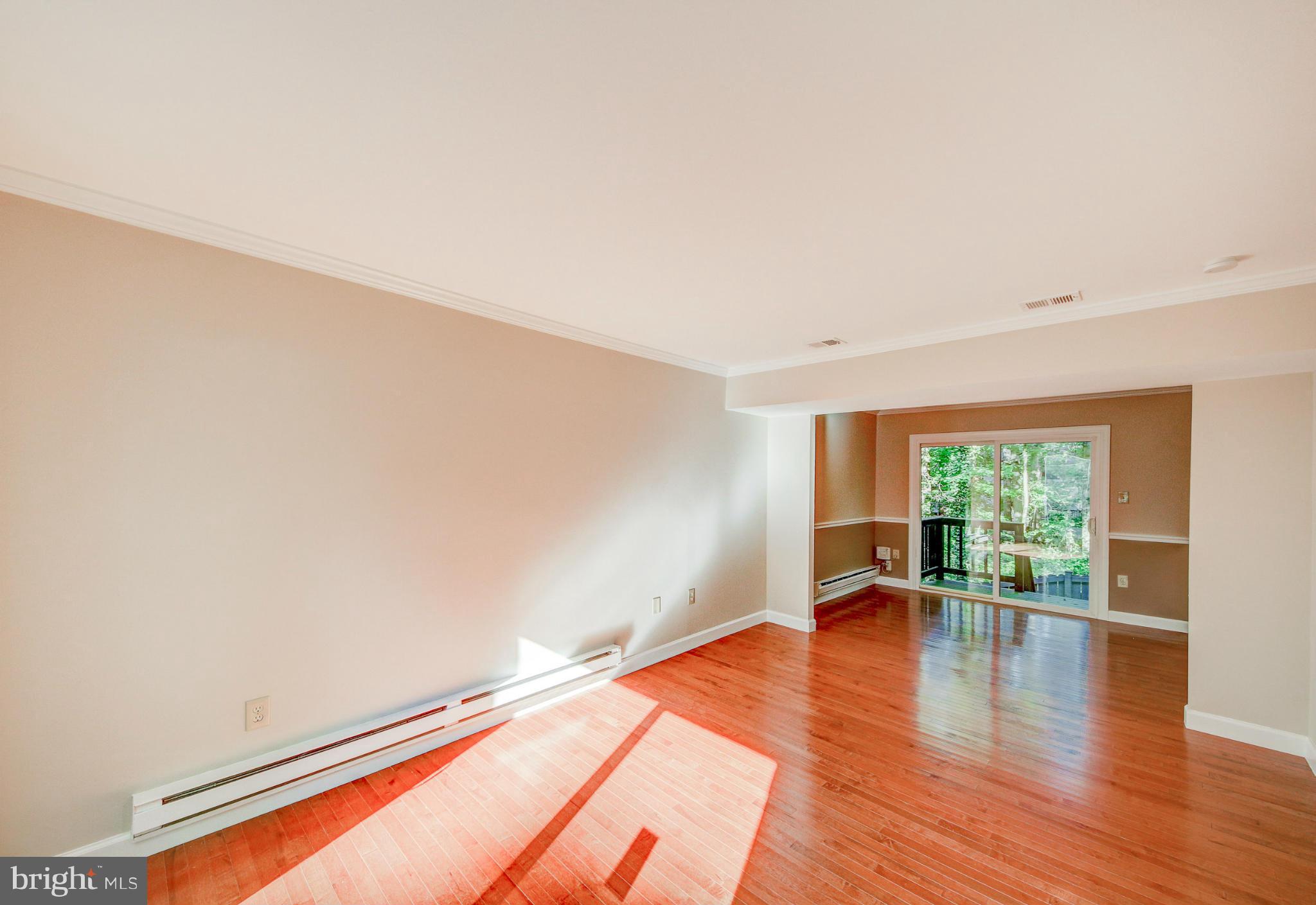 2459 Pyrenees Court Reston, VA 20191 - Photo 10 of 28 a hallway with wooden floor and furniture