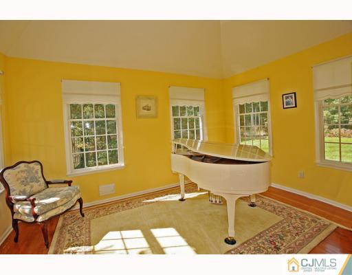 98 Bennett Road Old Bridge, NJ 07747 - Photo 5 of 10 a living room with a couch and piano table