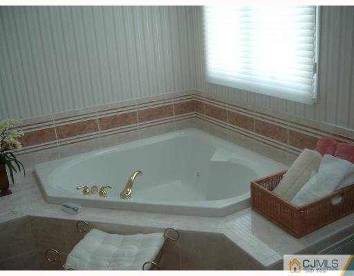 98 Bennett Road Old Bridge, NJ 07747 - Photo 7 of 10 a bath tub sitting next to a window