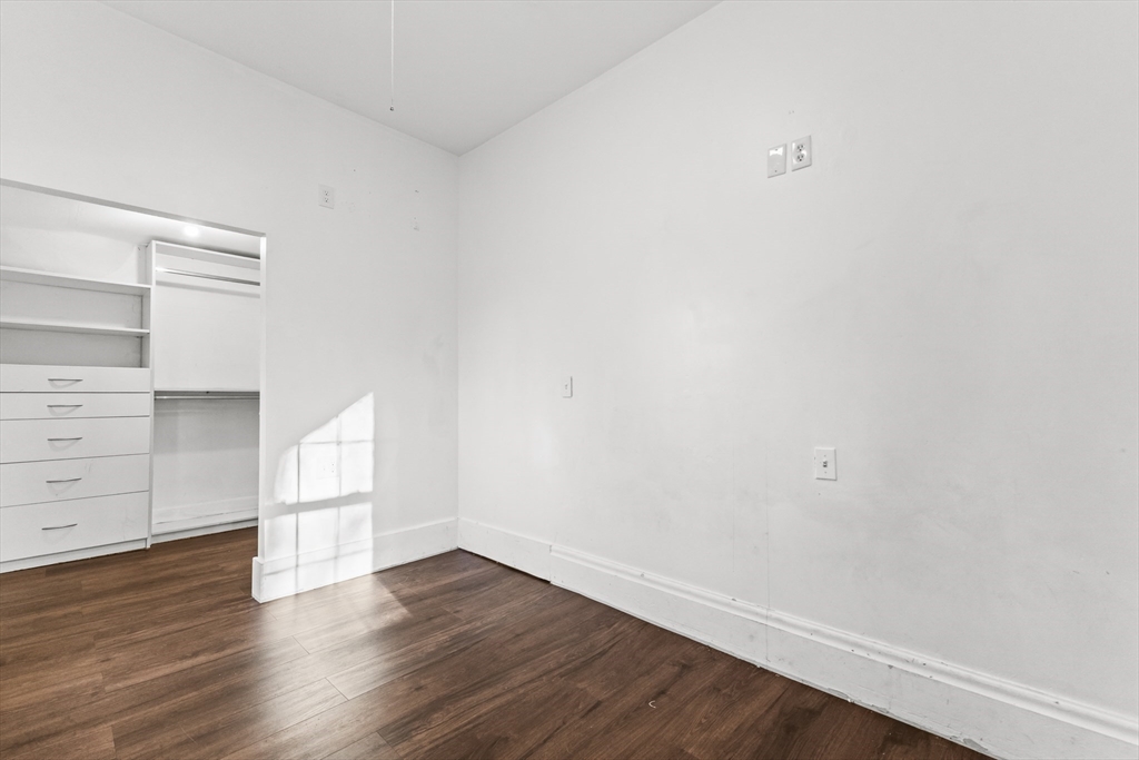 1142 Washington Street Whitman, MA 02382 - Photo 21 of 32 a view of an empty room with wooden floor