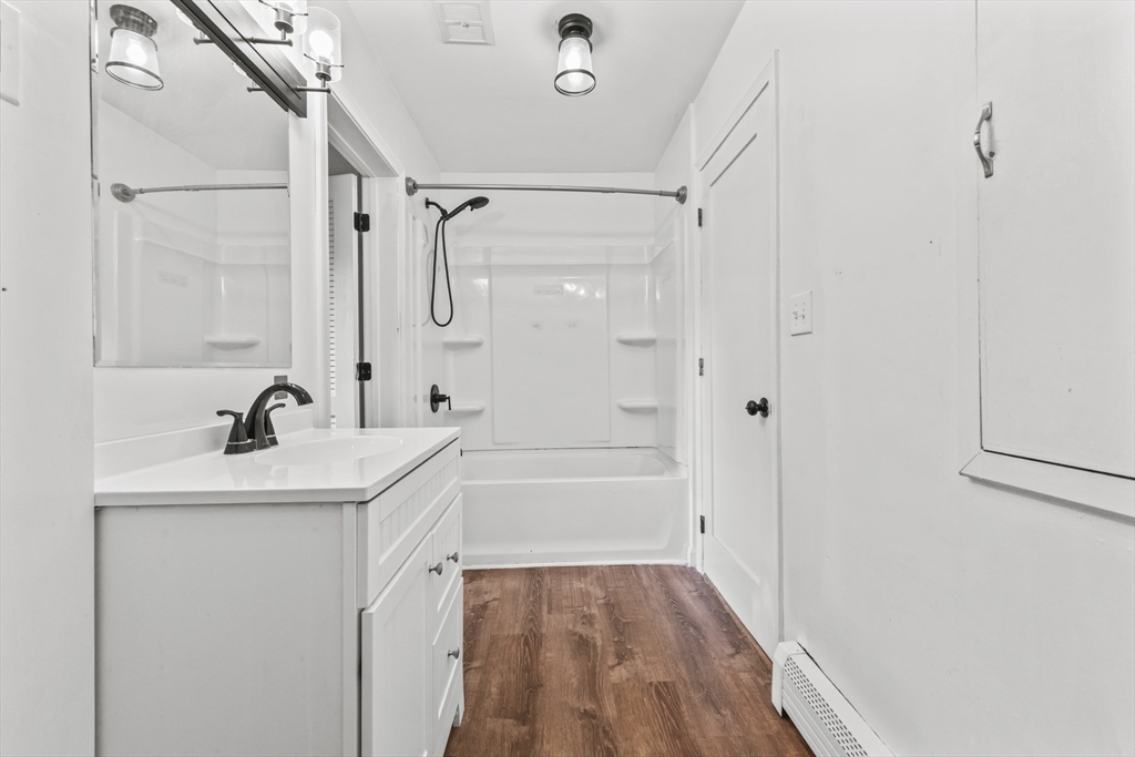 1142 Washington Street Whitman, MA 02382 - Photo 24 of 32 a bathroom with a sink a toilet and shower
