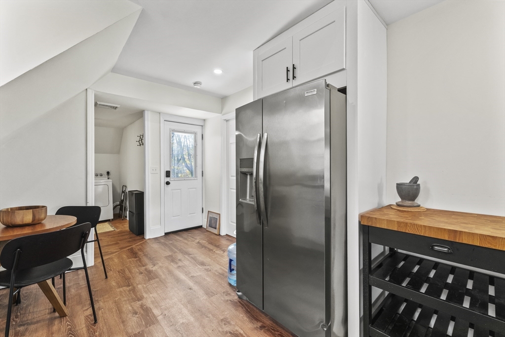 1142 Washington Street Whitman, MA 02382 - Photo 7 of 32 a kitchen with stainless steel appliances granite countertop a refrigerator and a sink