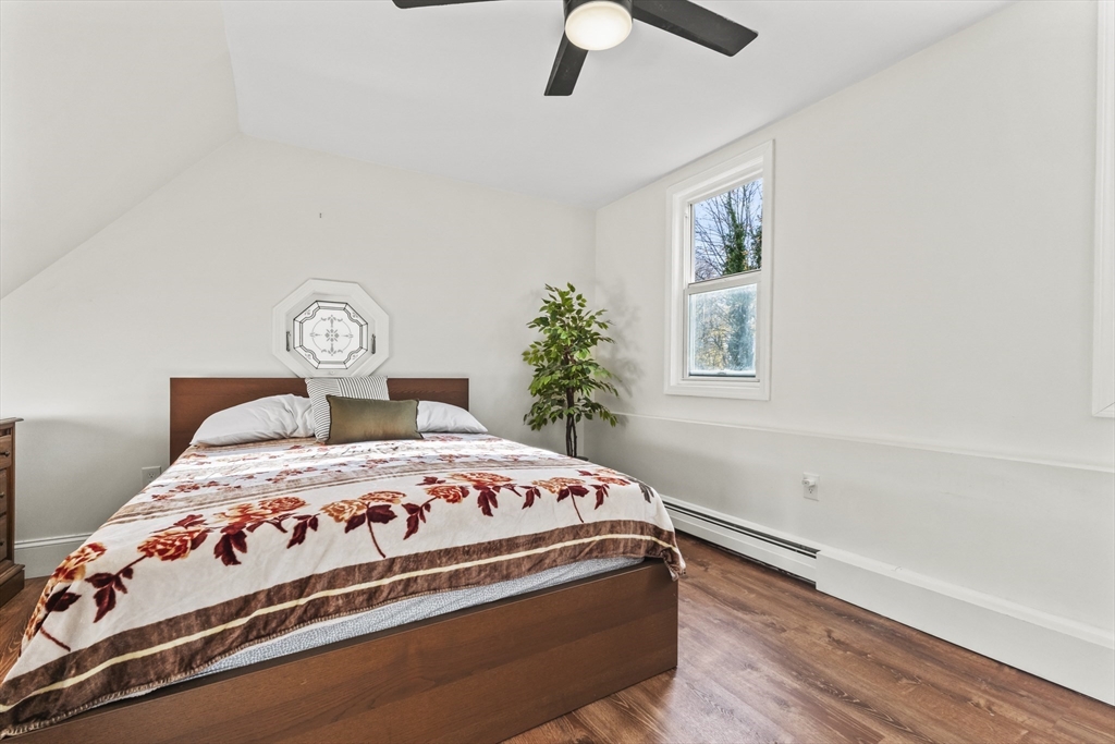 1142 Washington Street Whitman, MA 02382 - Photo 8 of 32 a bedroom with a bed and window