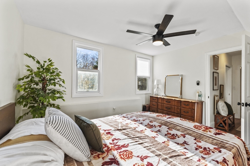 1142 Washington Street Whitman, MA 02382 - Photo 9 of 32 a bedroom with a bed and a dresser