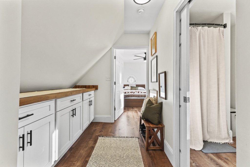 1142 Washington Street Whitman, MA 02382 - Photo 10 of 32 a hallway with white cabinets and wooden floor