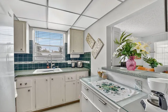 a view of a livingroom with furniture and a flat screen tv