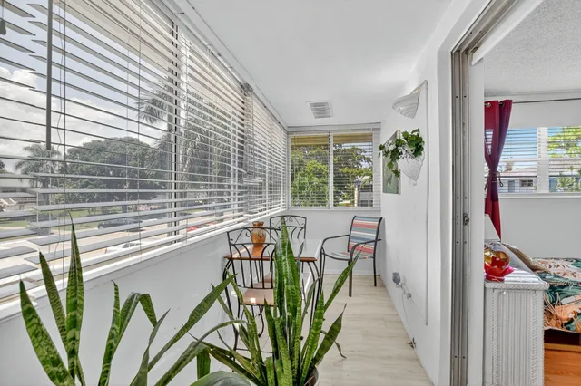a view of a balcony and furniture
