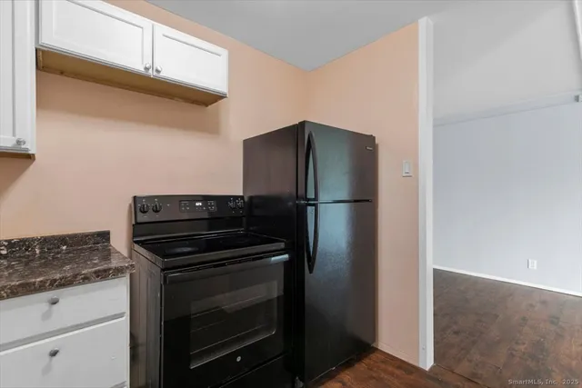 a kitchen with appliances and cabinets