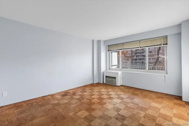 a view of an empty room with a window