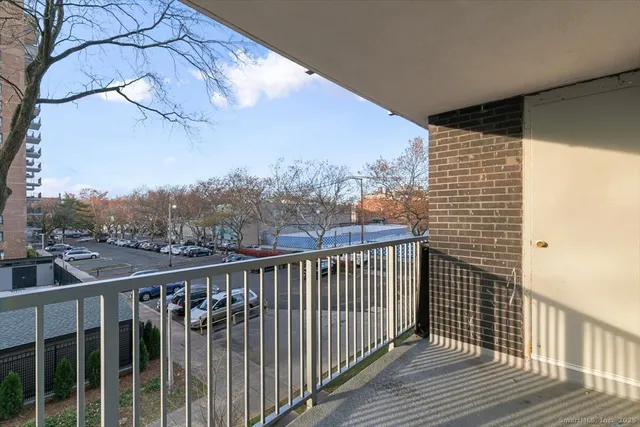 a view of balcony with wooden floor