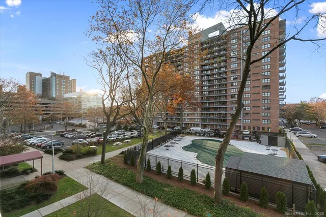 a view of a tall building from a balcony