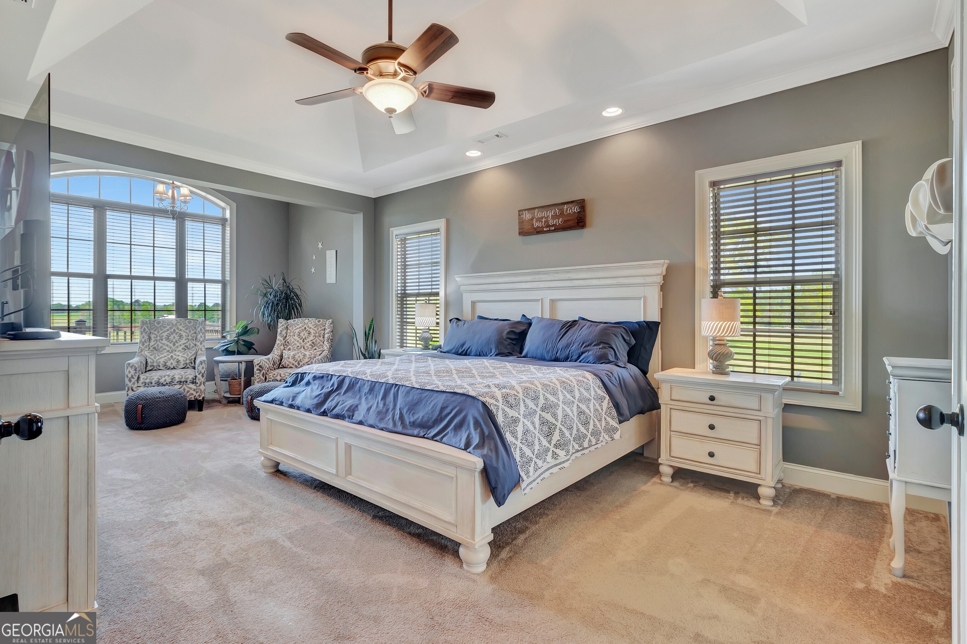 357 Brooks Road Brooks, GA 30205 - Photo 18 of 64 a bedroom with a bed and a chandelier