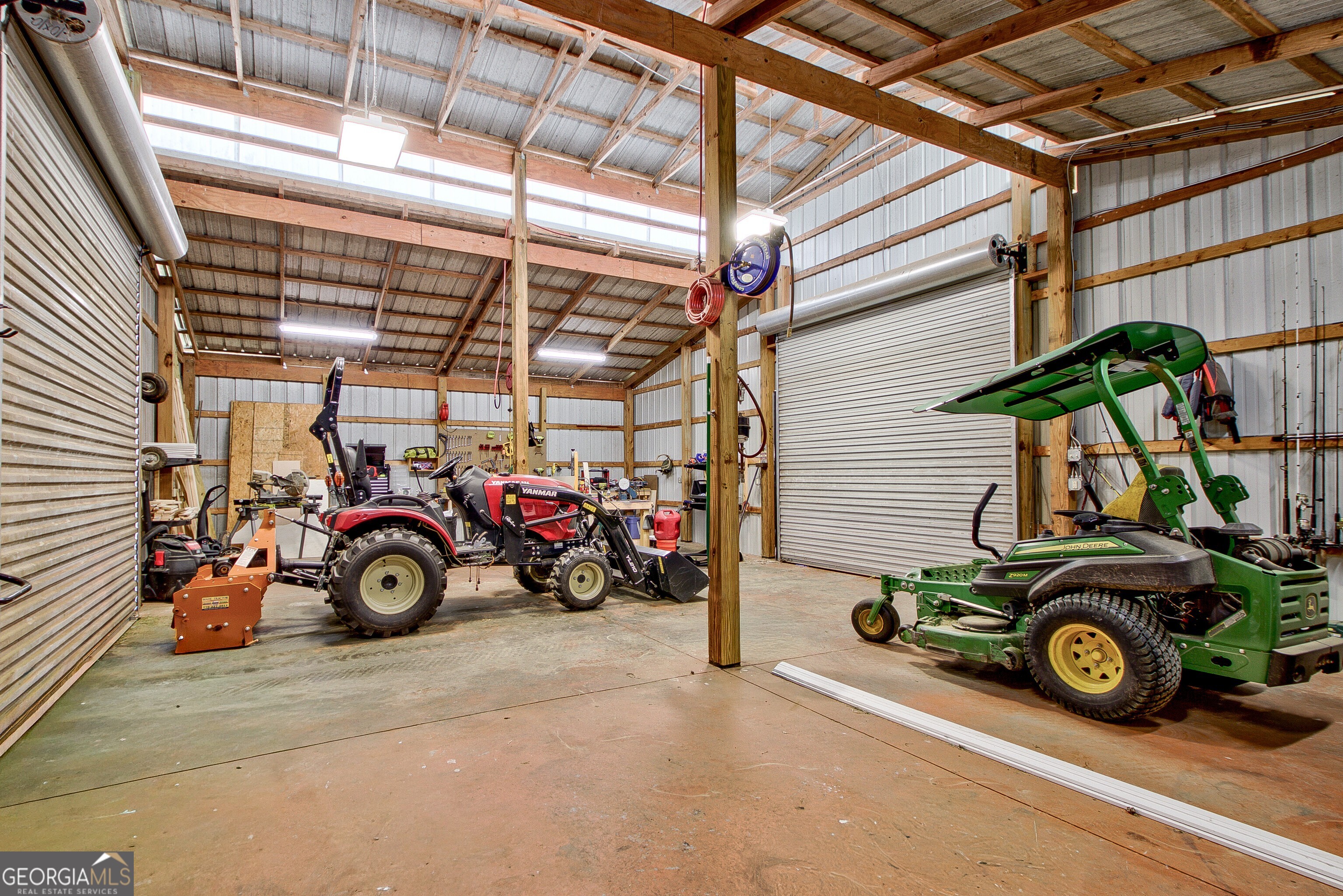 357 Brooks Road Brooks, GA 30205 - Photo 50 of 64 a view of a garage with a car and a car
