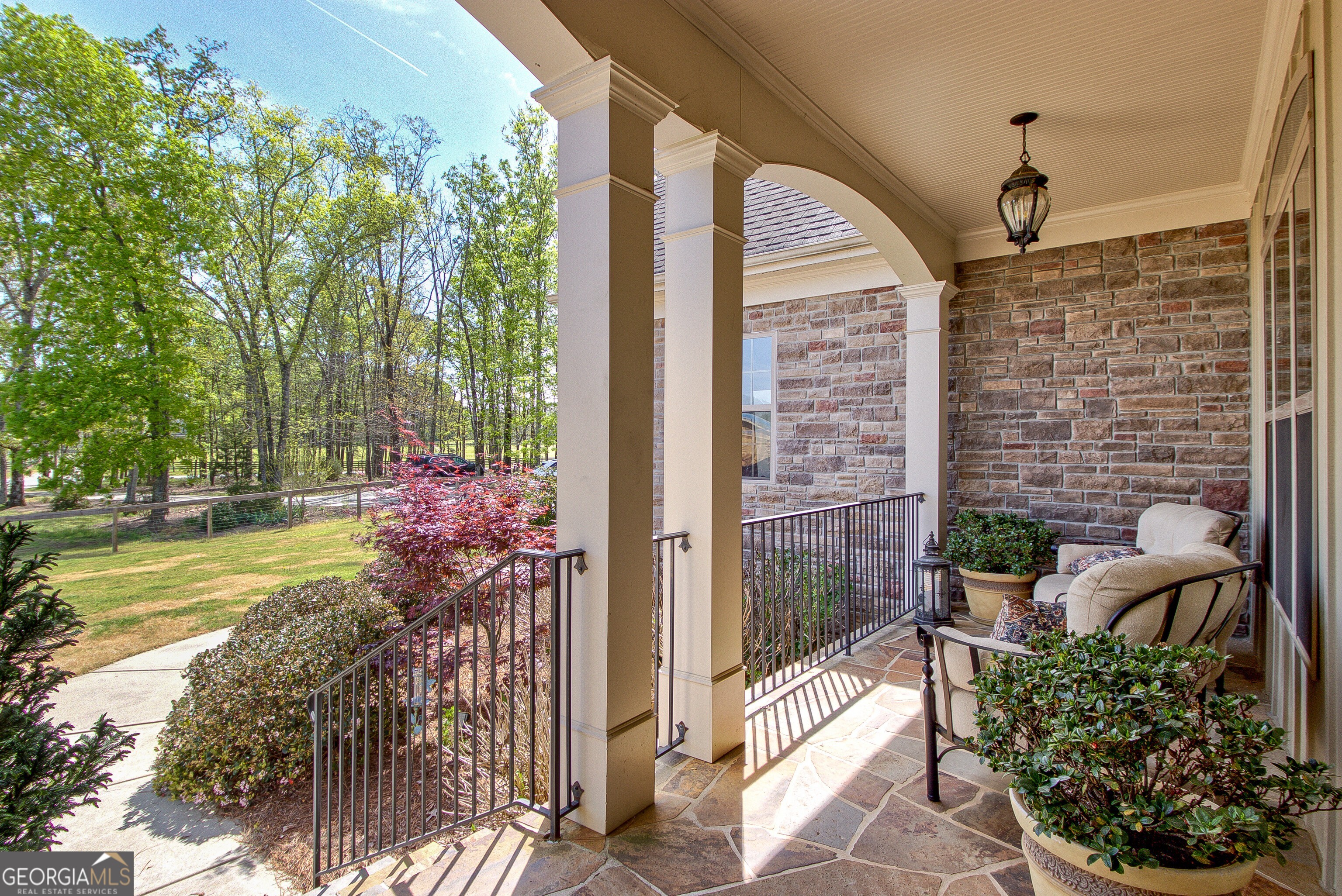357 Brooks Road Brooks, GA 30205 - Photo 8 of 64 a view of a porch with chairs and potted plants